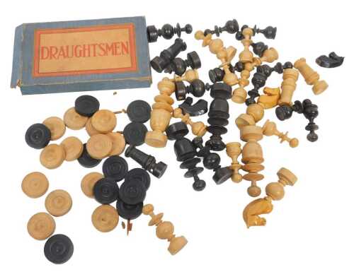 A carved wooden chess set, height of queen 8.5cm, and a carved wooden draughts set.