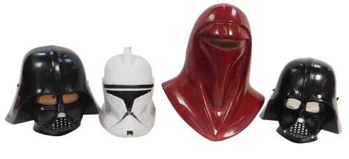 Four Star Wars replica helmets, a red Imperial Royal Guard helmet, 43cm high, a Clone Trooper...
