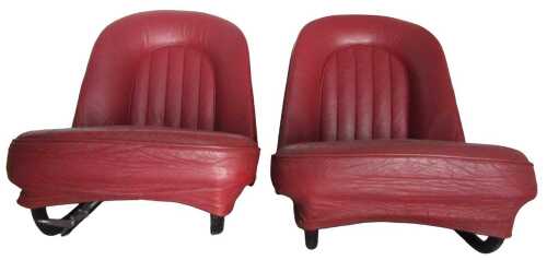 A pair of red leather seats possibly from a Daimler SP250.