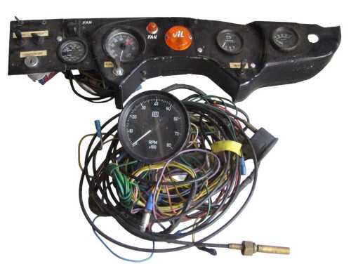 A racing dashboard, including an SW RPM counter, TIM RPM counter, a Race Tech oil and water...