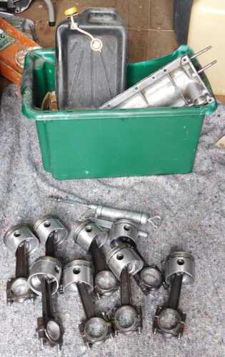 Various engine parts, including valves, pistons, crankshaft, etc.