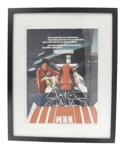 A Duckhams Motor Oil poster print, depicting Alan Challis, chief mechanic for BRM Racing Team,...