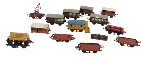 Hornby O gauge tinplate rolling stock, including an LMS brake van, three LMS crimson coaches,...