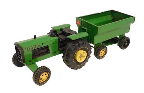 A Tonka pressed steel tractor and trailer, in green.