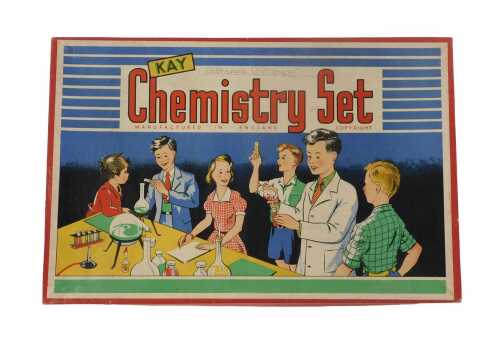 A Kay chemistry set, including Experiments in Chemistry booklet, litmus paper, paraffin burner,...