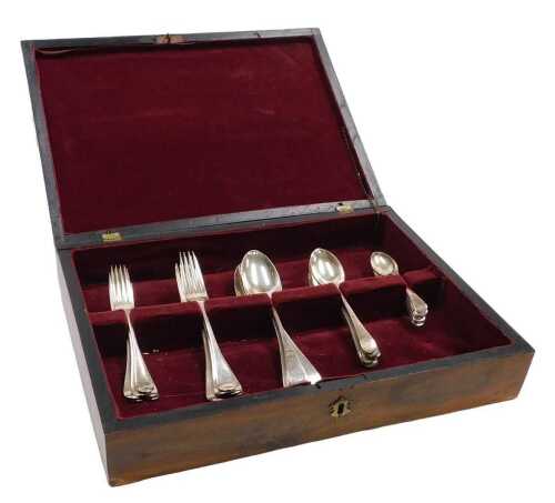 An Edward VII and later silver canteen of Old English pattern harlequin cutlery, comprising six...