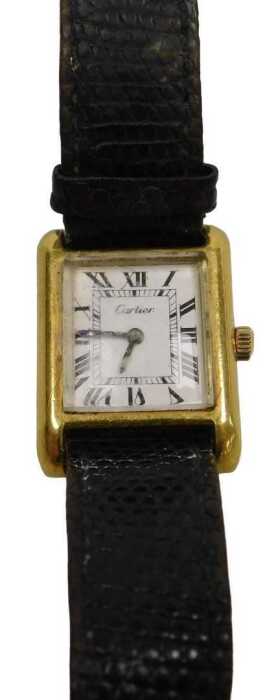 A Cartier lady's tank pre-must 18ct gold plated lady's wristwatch, square dial bearing Roman...