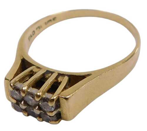 An 18ct gold and diamond six stone ring, in a high claw setting, size P&frac12;, 4.5g.