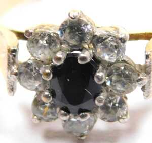 A 9ct gold sapphire and cz flower head ring, in a claw setting, size O, 2.1g all in. - 2