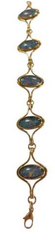 A 9ct gold and opal bracelet, of five links set with oval cabochons, on a lobster claw clasp, 17....