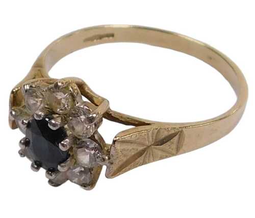 A 9ct gold sapphire and cz flower head ring, in a claw setting, size N&frac12;, 2.0g all in.