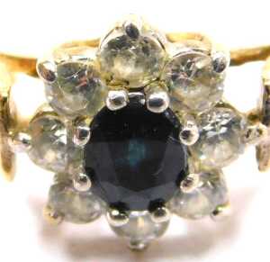 A 9ct gold sapphire and cz flower head ring, in a claw setting, size N&frac12;, 2.0g all in. - 2