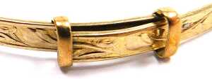 A 9ct gold plated bangle, with foliate engraving, with sliding adjustment. - 2