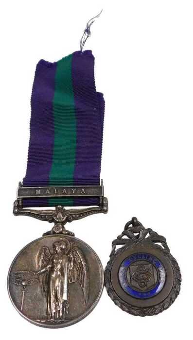 A Queen Elizabeth II British General Service medal, with Malaya clasp, named to CFN A Douglass,...
