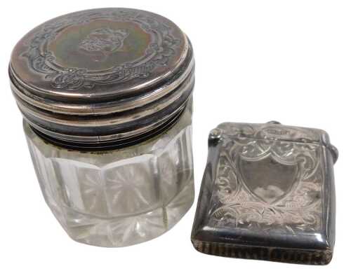 An Edward VII silver vesta case, with engraved foliate decoration, vacant shield reserve,...