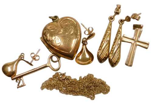 A pendant cross, yellow metal, stamped 9ct, a fine link neck chain, a 21 key birthday charm, and...