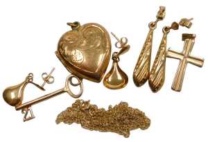 A pendant cross, yellow metal, stamped 9ct, a fine link neck chain, a 21 key birthday charm, and...
