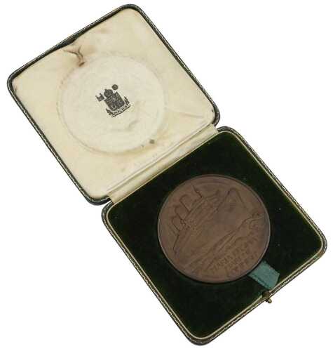 A RMS Queen Mary bronze commemorative medal, for her maiden voyage in 1936, commissioned from...