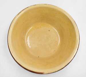A late 19thC terracotta and cream glazed dairy bowl, 36cm wide. - 2