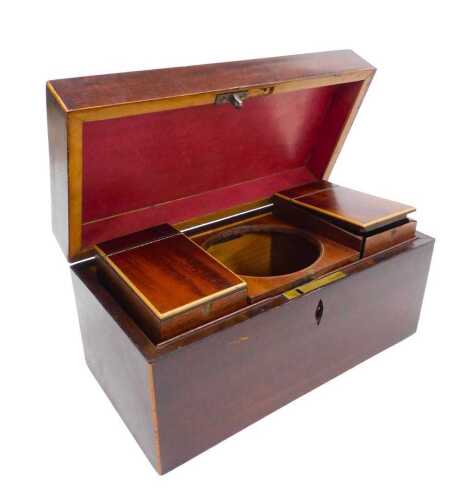 A Georgian mahogany tea caddy, of rectangular section, with boxwood line inlay, the hinged lid...
