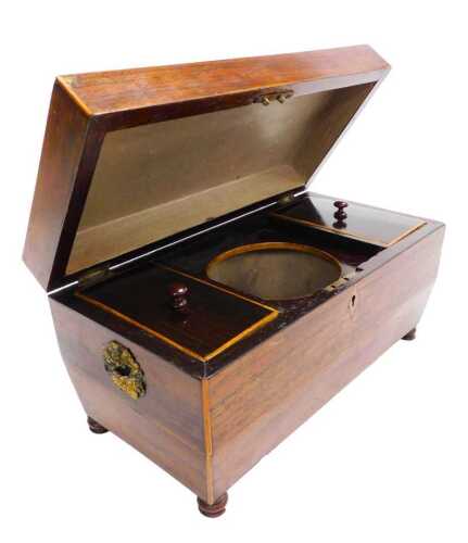 A Regency rosewood tea caddy, of sarcophagus form, the hinged lid opening to reveal two lidded...