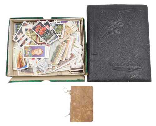 Cigarette cards. In an album and loose, including Wills's Flower Culture in Pots, John Player...