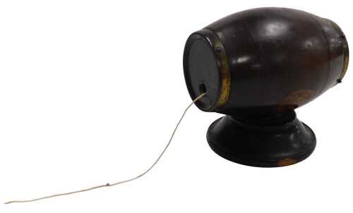 A 19thC Lignum Vitae treen string box, of barrel form, brass bound, 9cm wide.