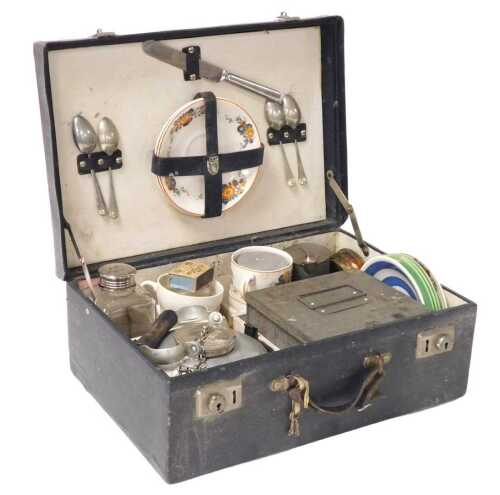 An early 20thC picnic set, cased, to include a Sirram rambler kettle, cups, saucers, plates and...