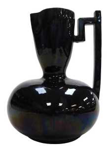 A late 19thC Samuel Lear Arts and Crafts Japanese style pitcher, designed by Christopher Dresser,...