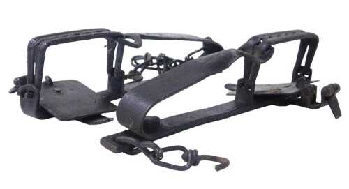 A 19thC cast iron animal trap, 30cm wide.