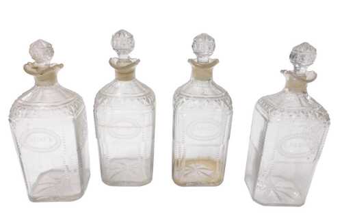 A set of four Regency cut glass decanters and stoppers, with oval reserves engraved for R,...