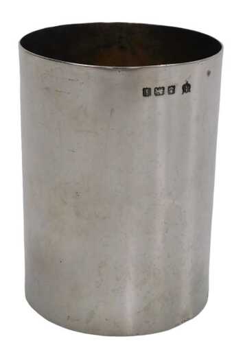 An Edward VII silver beaker, of plain cylindrical form, Birmingham 1908, 7.5cm high, 5.5cm diam,...