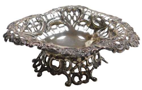 A Victorian silver heart shaped pedestal sweet meat dish, with pierced and embossed floral C and...