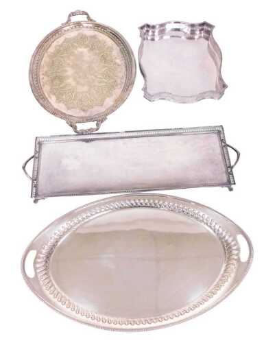 A Victorian silver plated Elkington and Company twin handled oval tray, further Victorian tray...