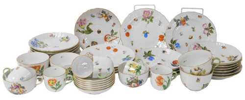 An associated 20thC Herend porcelain part tea and coffee service, painted with fruits, nuts and...