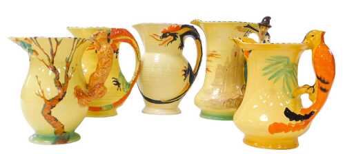 Five early 20thC Burleighware pottery jugs, comprising an exotic bird jug, two dragon jugs,...