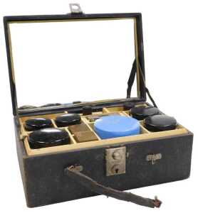A mid 20thC black leather cased Helena Rubinstein cosmetics case, containing perfume bottles,...