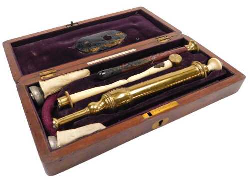 A late 19thC medical enema pump set, by Evans & Wormull, 31 Stamford Street London, mahogany cased.
