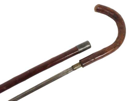 An early 20thC hazel sword stick, with a plated ferule, 93cm high.