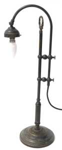 An early 20thC brass desk lamp, with a curved arm, raised on a stepped circular base, 61cm high,... - 2