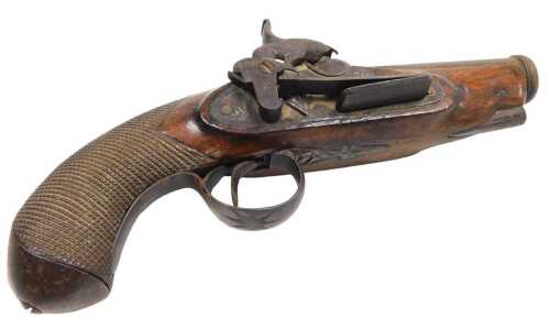 A late 18thC pistol, with engraved barrel and walnut stock and chequered grip, with later...