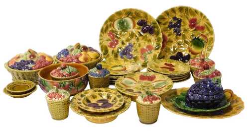 A group of early 20thC Sarreguemines pottery, relief decorated with fruit, including preserve...
