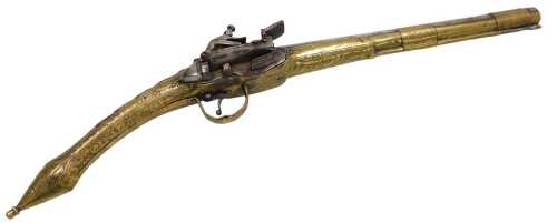 A 19thC Balkan Miquelet flintlock pistol, the stock butt and grip clad with engraved brass and...