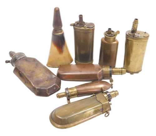 Eight 19th and 20thC powder flasks, including two horn flasks, copper and brass examples with...