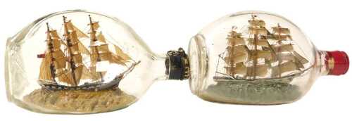 Two ships in bottle models, both of three masted sailing ships, housed in Haig Dimple whisky...