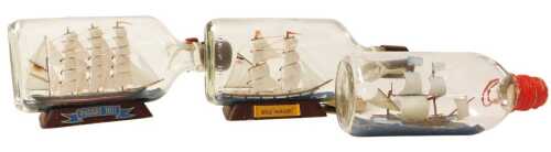 Three ships in bottle models, one inscribed Passet 1911 and the other Brigg Hamberg, 21cm long,...