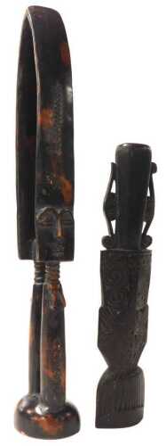 An African tribal twin fertility figure, carved with two female figures on a domed foot, and an...