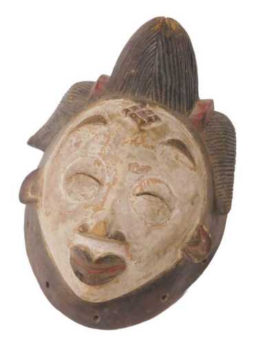 A Gabonese Punu tribal mask, with elaborate carved headdress, white painted face with red...