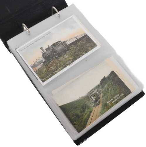A quantity of postcards, mainly showing early to mid 20thC locomotives, some photographs. (1 album)