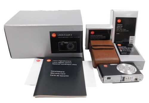 A Leica C-Lux2 digital camera, with a leather case, in original box with accessories and...